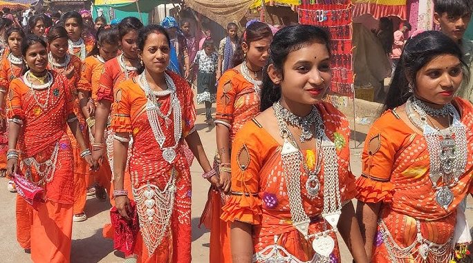 Tribal woman in traditional attire wearing a silver Paan Vala Haar necklace during Bhagoriya festival
